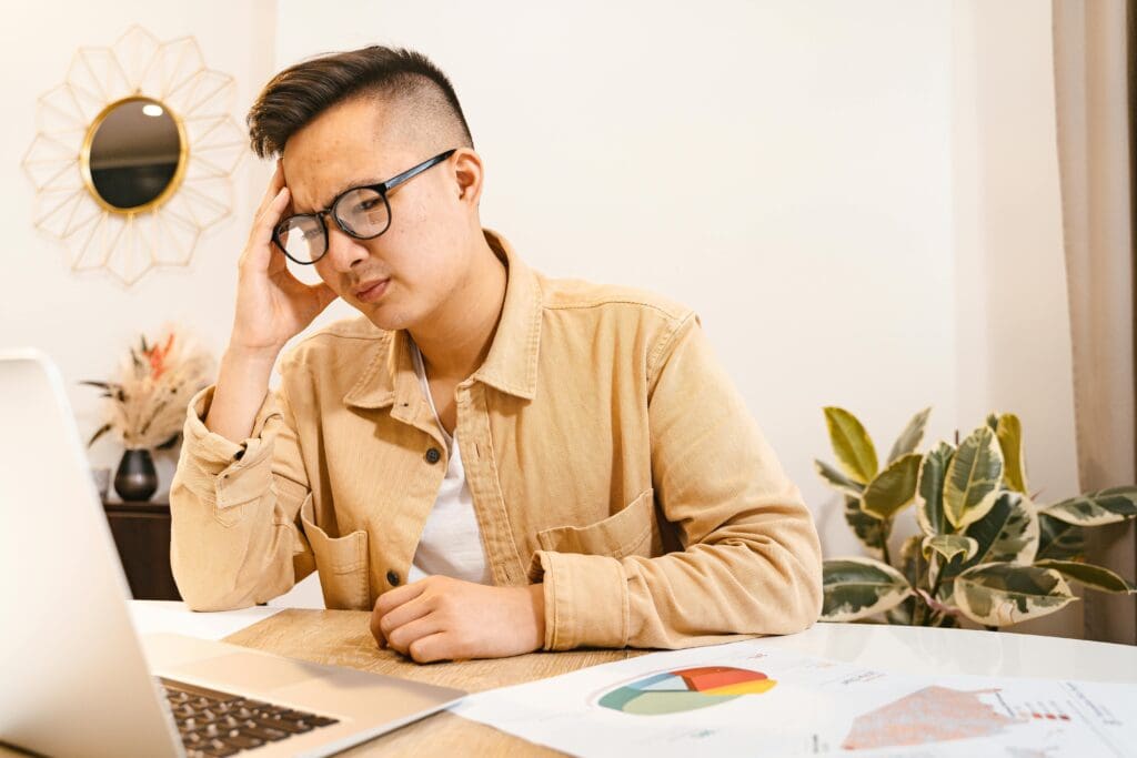 Person looking stressed at desk