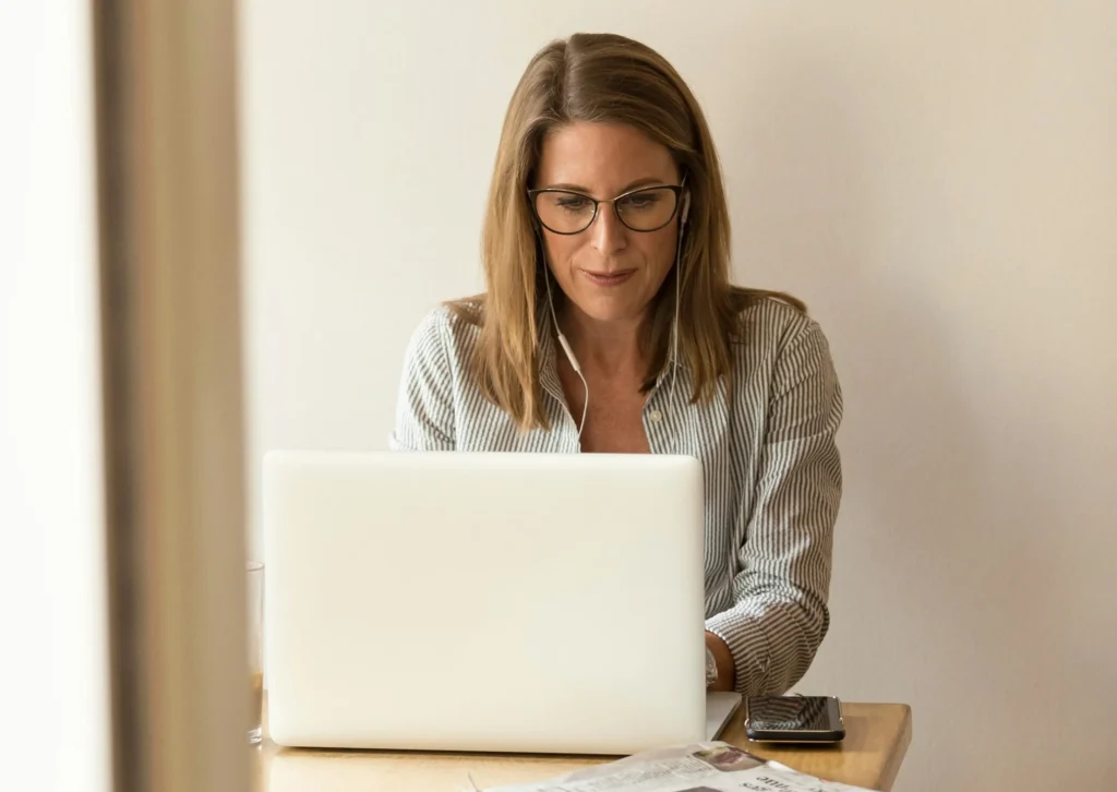 Person working on a laptop indoors.