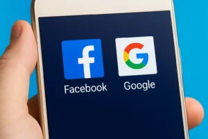 Logos of Facebook and Google displayed